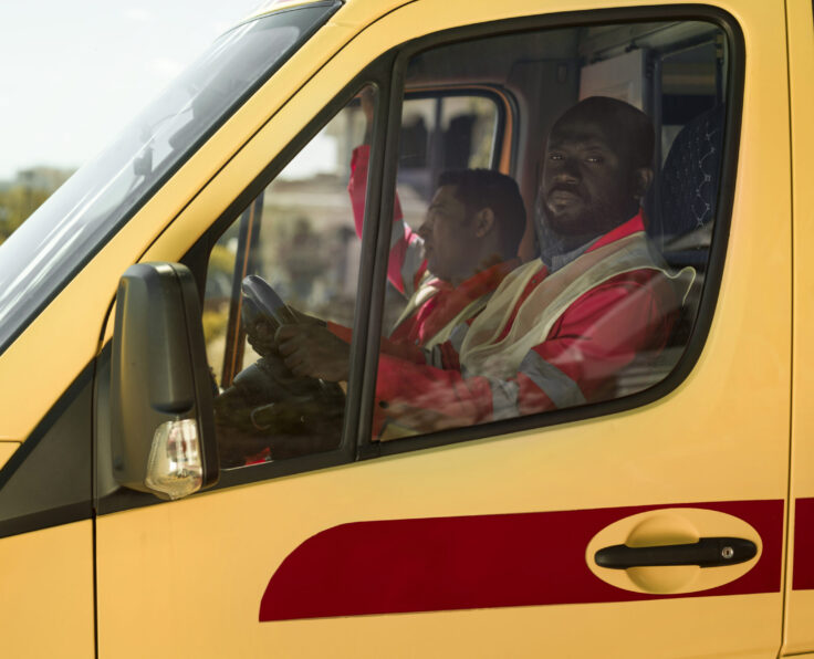 medium-shot-paramedic-driving-ambulance